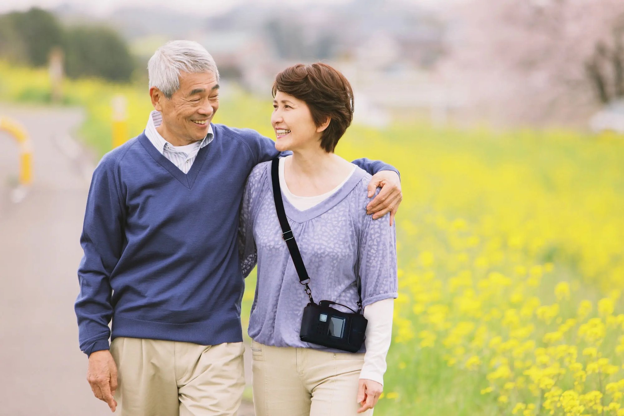 LifeVest wearable cardioverter defibrillator patient and spouse take a walk in a park