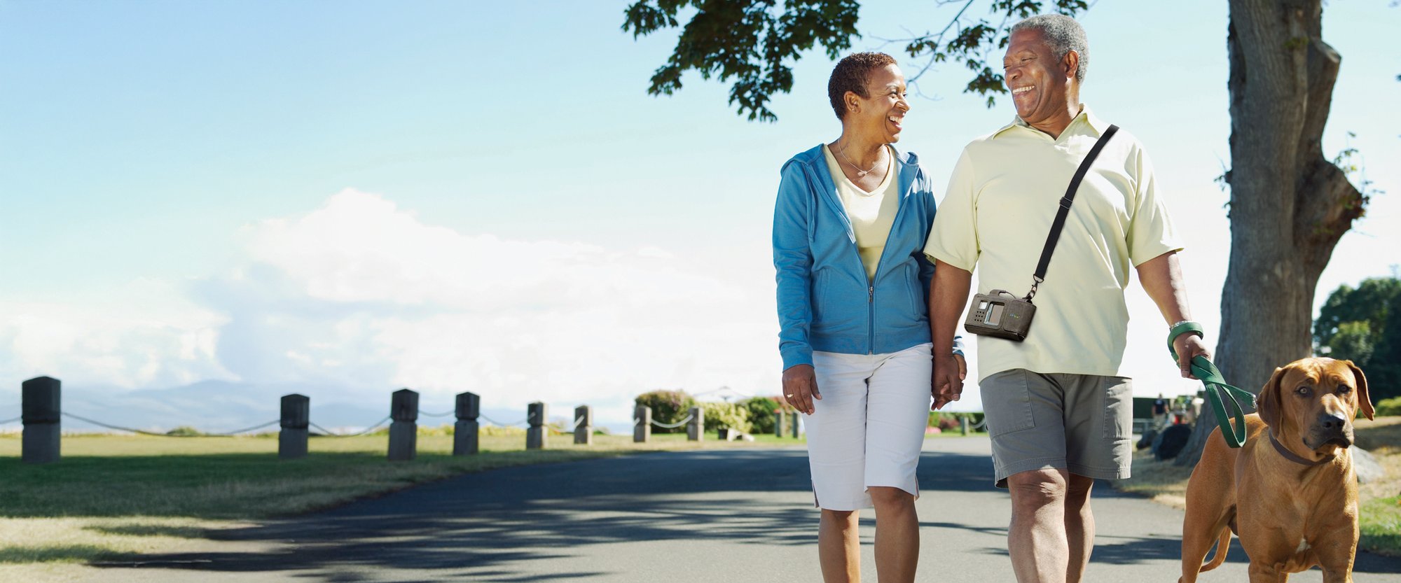 ZOLL LifeVest patient and spouse walking dog outside