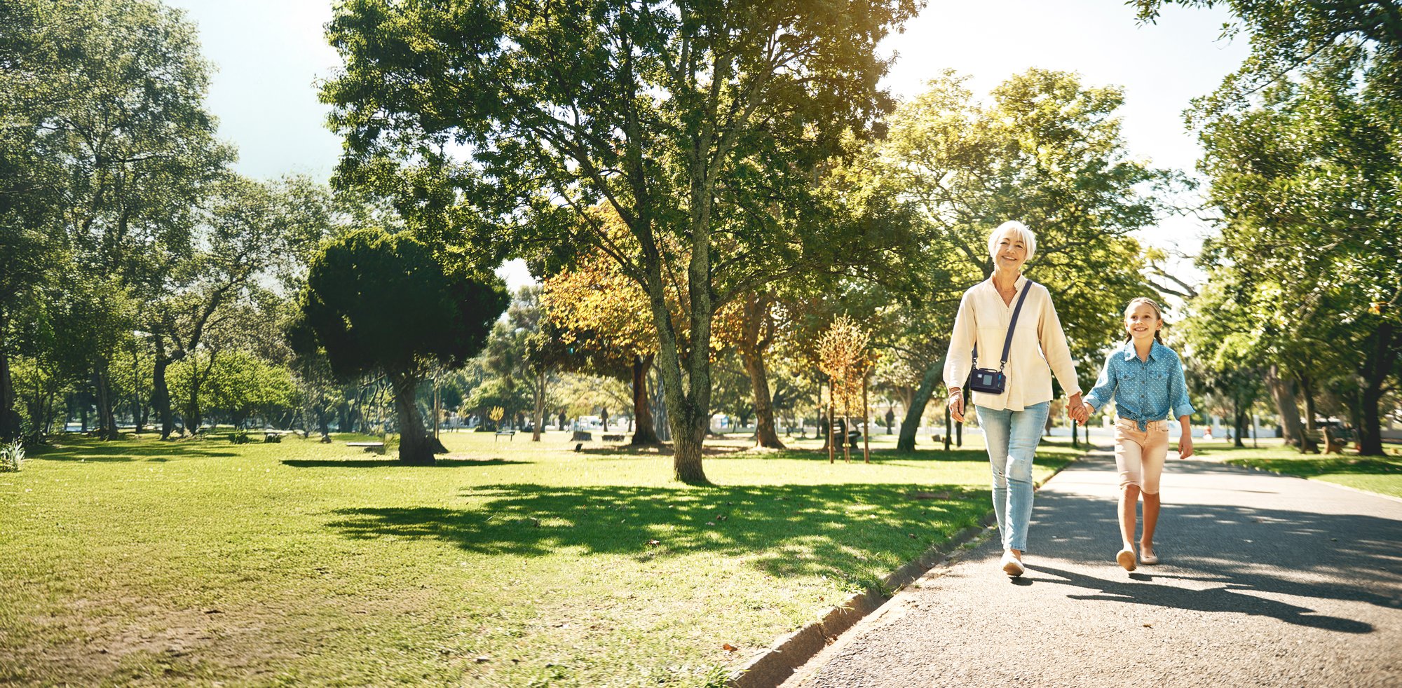 ZOLL LifeVest patients walks through a park with grandchild