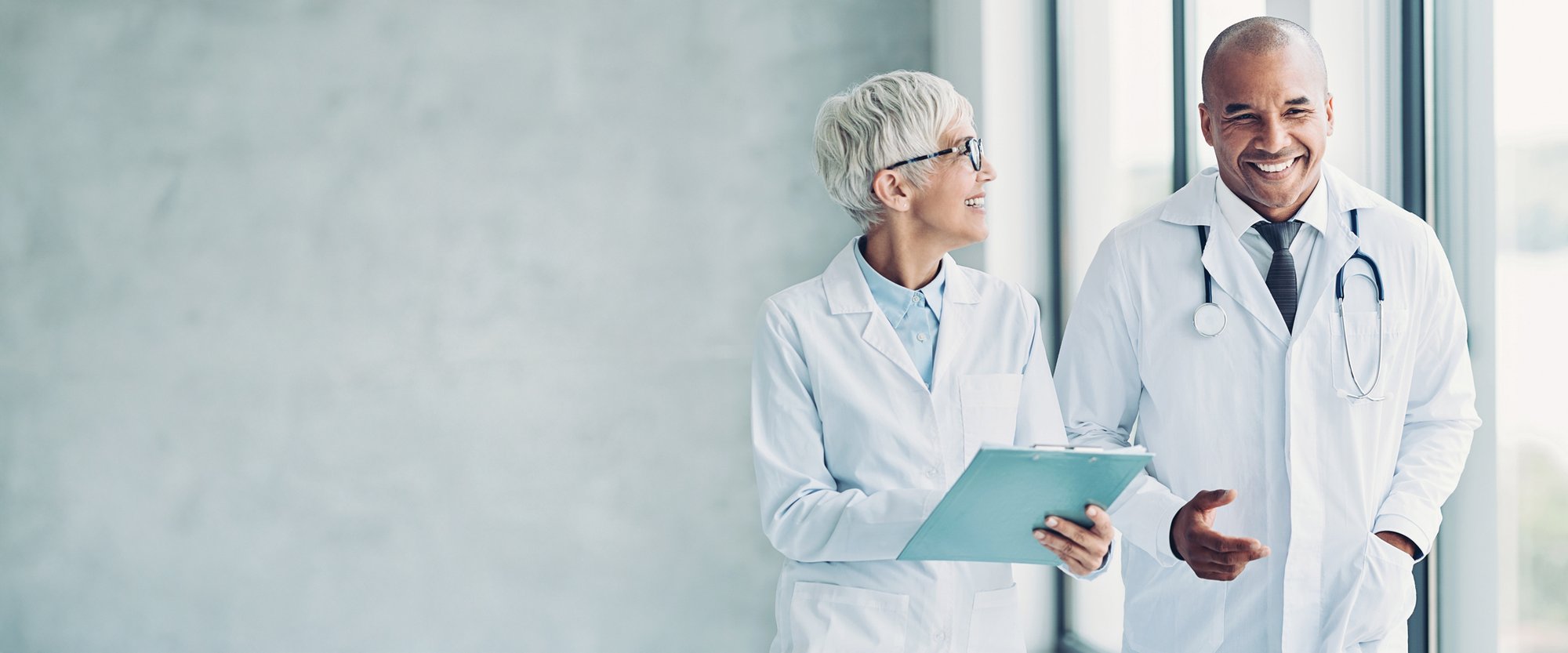 two healthcare professionals talking