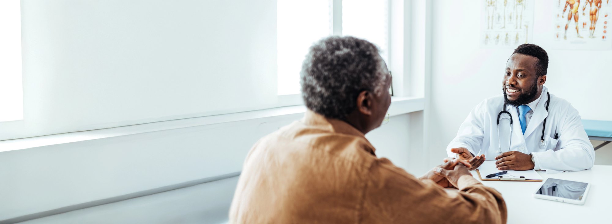 Cardiologist sitting and talking with a LifeVest wearable cardioverter defibrillator patient