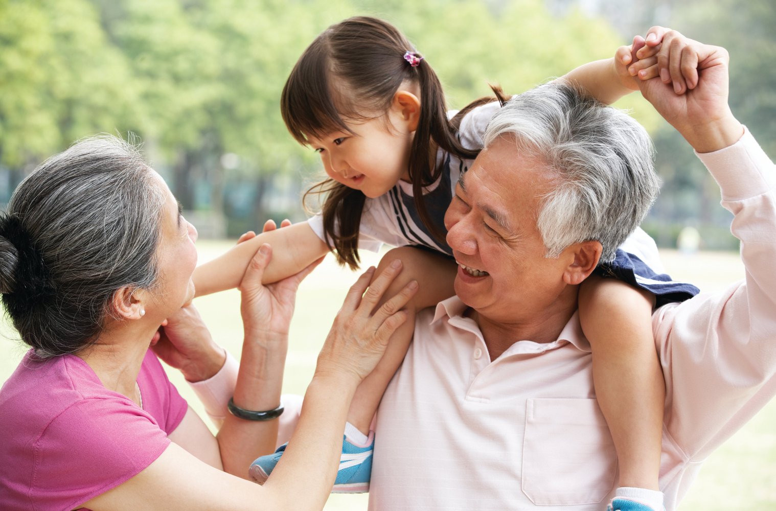 grandparents with grandchild outside